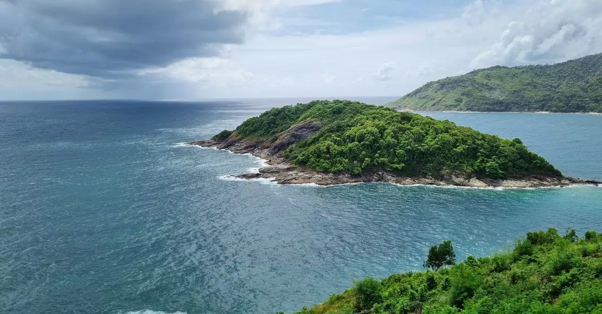 Beautiful aerial view of an island with lush greenery in Phuket, Thailand.