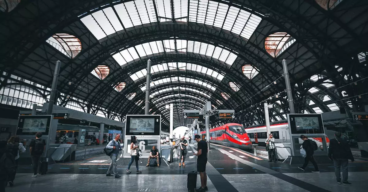 Commuters at Milano Central Station featuring modern trains under the iconic arched roof.
