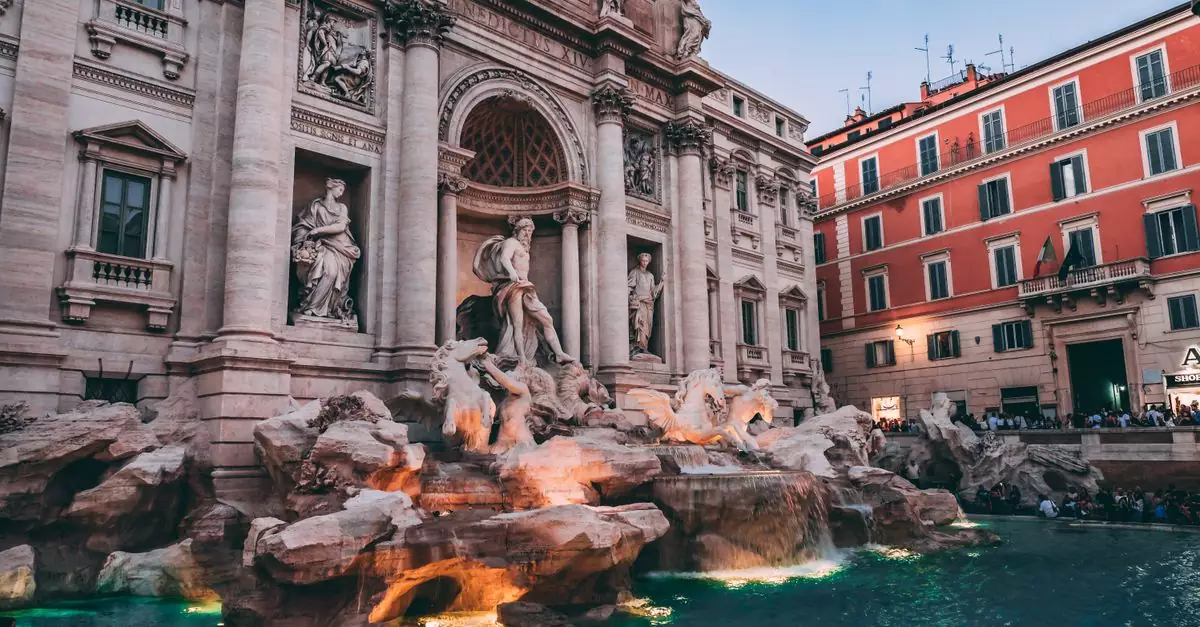The iconic Trevi Fountain in Rome, a masterpiece of Baroque architecture, captured at dusk.