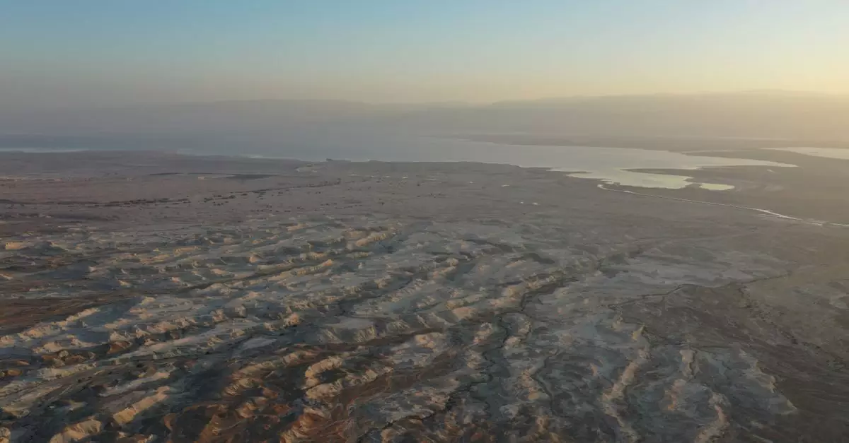 Stunning aerial view of Masada and the Dead Sea during sunset, showcasing natural beauty in South District, Israel.