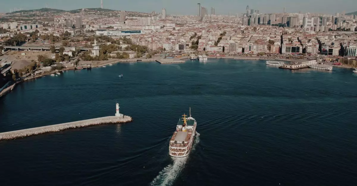 Captivating aerial shot of Istanbul skyline with a ship on the Bosphorus, showcasing iconic cityscape and tranquility.