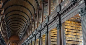 Expansive view of the historic Long Room library in Trinity College Dublin.
