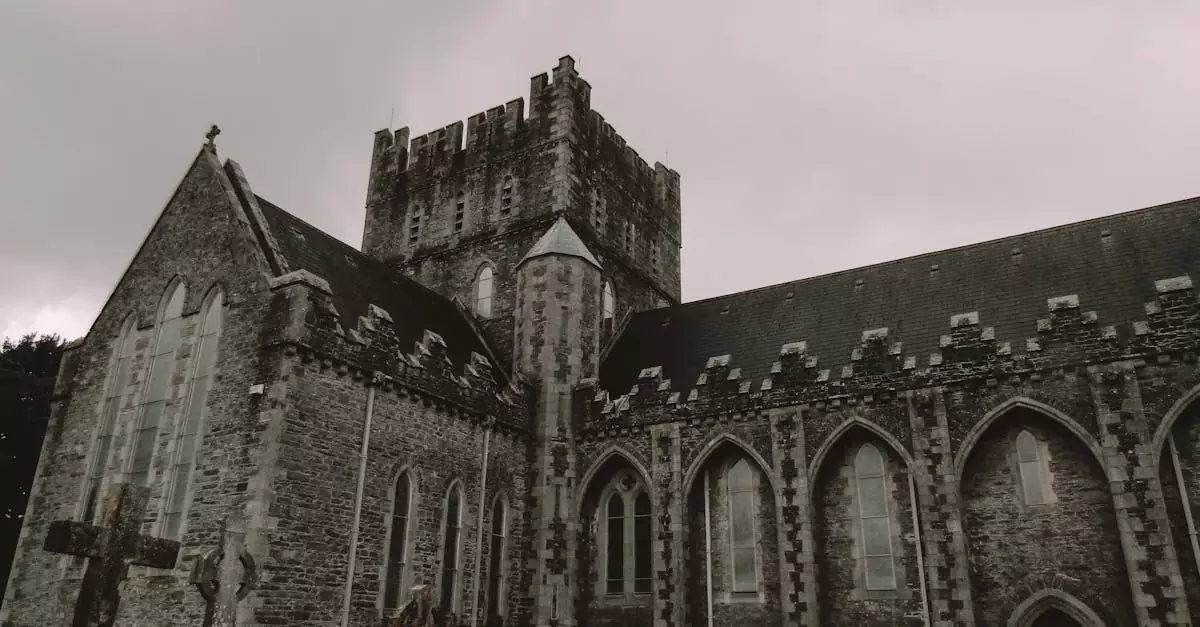 Historic gothic cathedral exterior with cloudy sky in Ireland, showcasing detailed architecture.