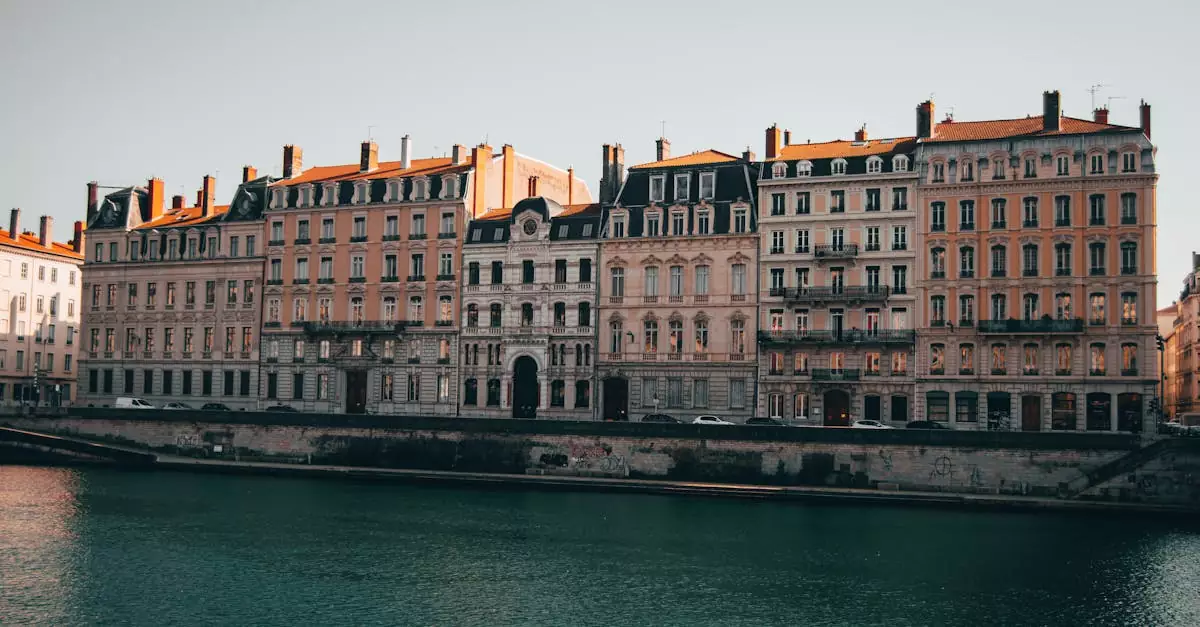 Charming view of historic buildings lining the Rh&ocirc;ne River in Lyon, France.