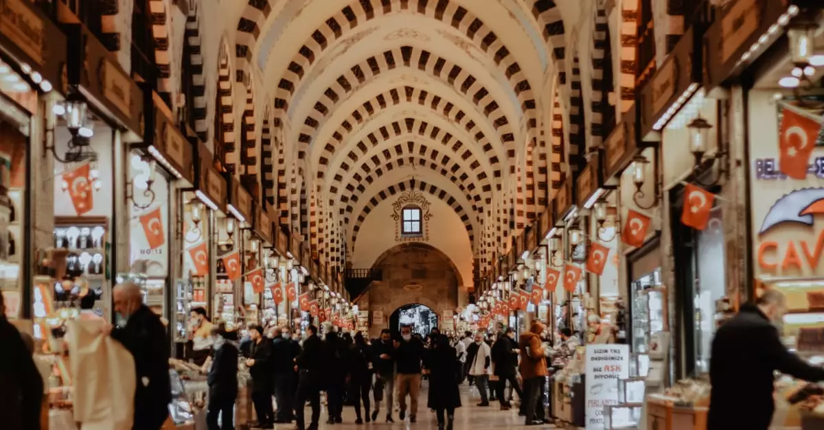 Explore the vibrant hustle of Istanbul's Grand Bazaar with shops and crowds.