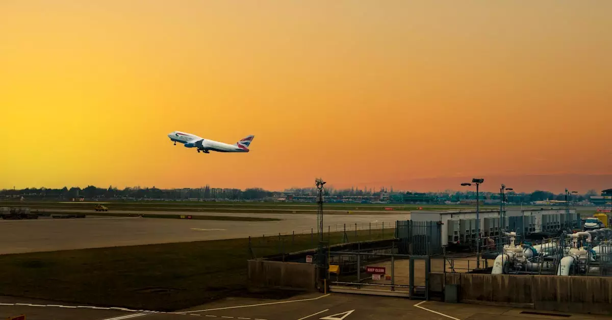 Airplane ascending during sunset at Heathrow Airport, capturing the vibrant sky.