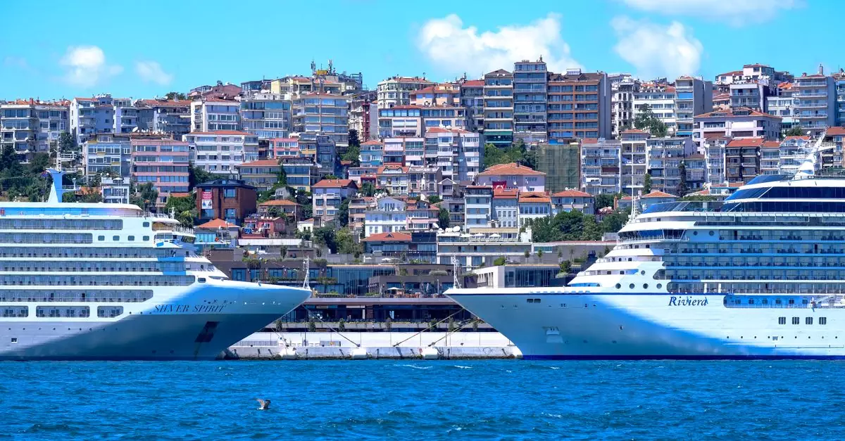 Two luxury cruise ships moored by the scenic Istanbul waterfront with iconic city skyline in the background.