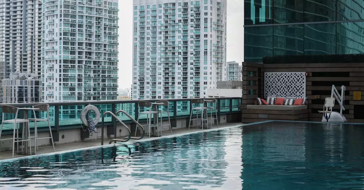 Elegant rooftop pool overlooking a modern urban skyline in Miami. Perfect for travel and luxury imagery.