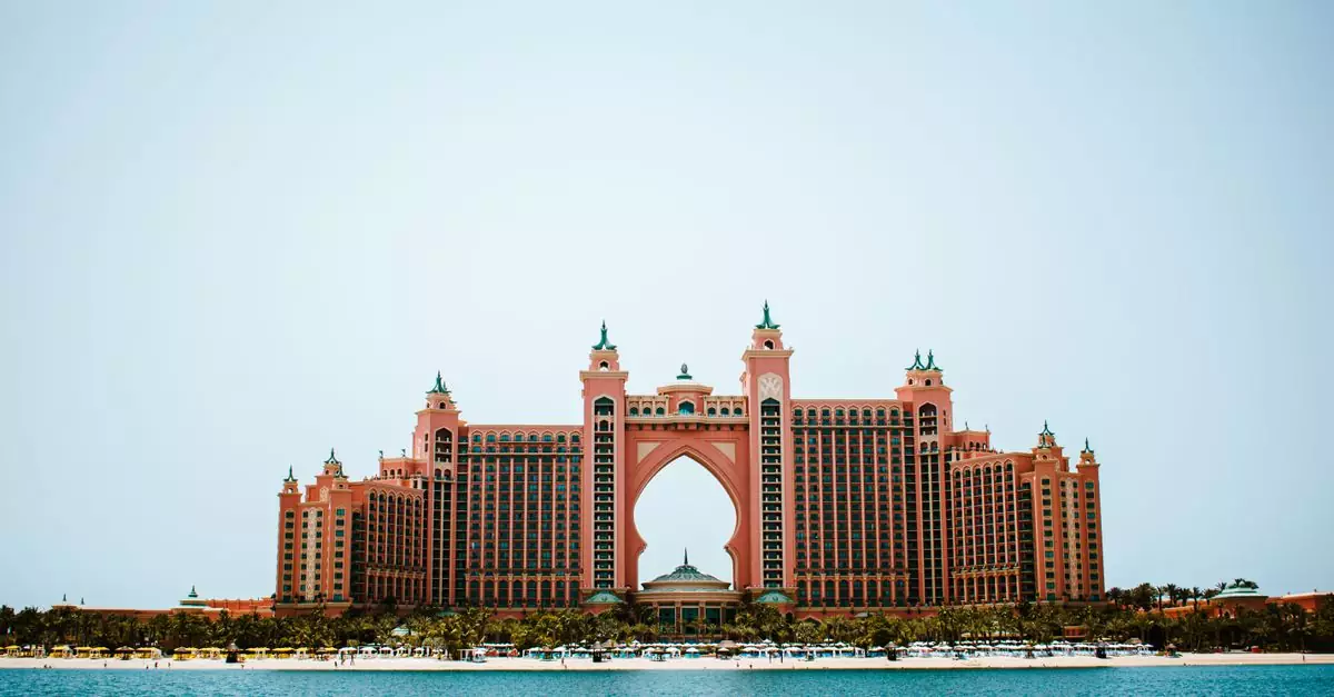 Spectacular view of Atlantis Hotel on Palm Jumeirah, Dubai, with a clear blue sky and tranquil ocean.