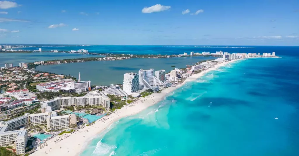 Best Mexico Island Getaways: Your Ultimate Guide 2 Beautiful aerial view of Cancun's coastline with clear blue waters and luxury resorts.