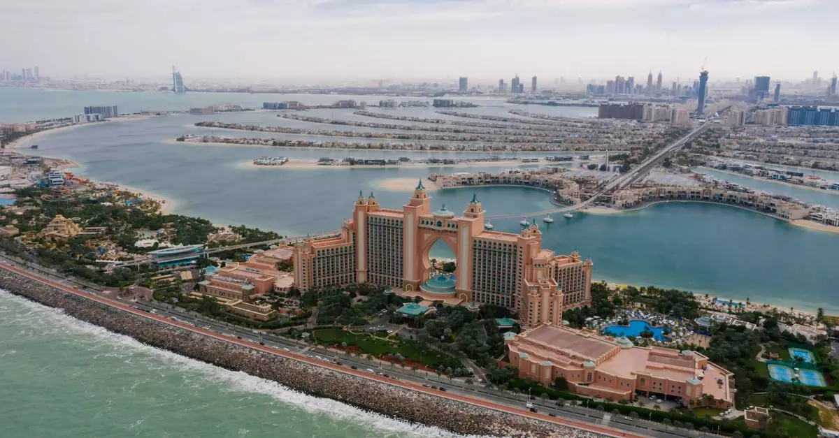 A stunning aerial view of Atlantis The Palm hotel with Dubai's skyline and sea in the background.