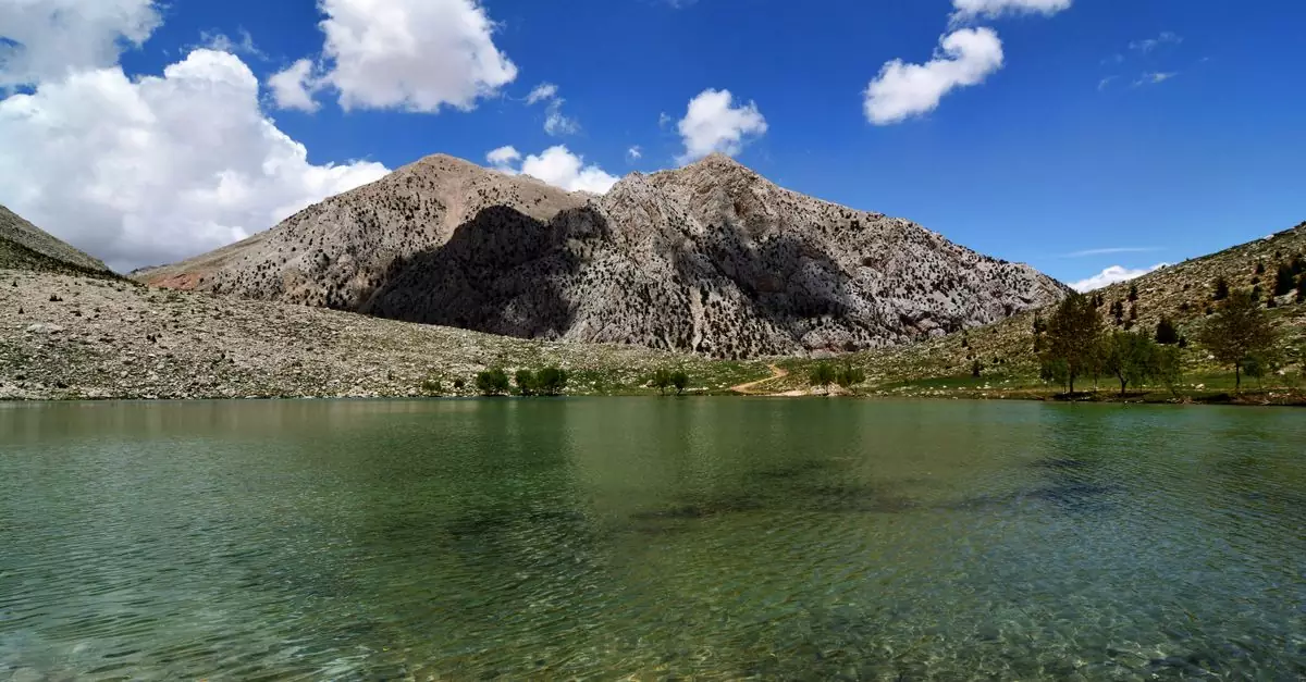 Stunning mountain lake view in G&ouml;mbe, Antalya, with clear skies and natural beauty.