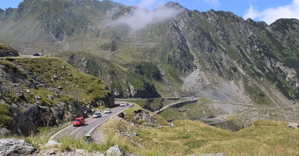 Discover the breathtaking curves of Transfăgărășan Highway in the majestic Carpathian Mountains.