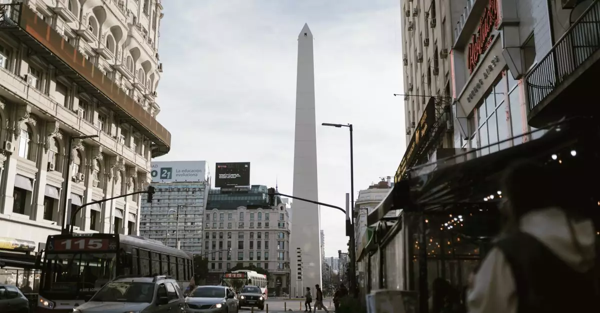 Urban view of Buenos Aires featuring the iconic Obelisk and lively street traffic.