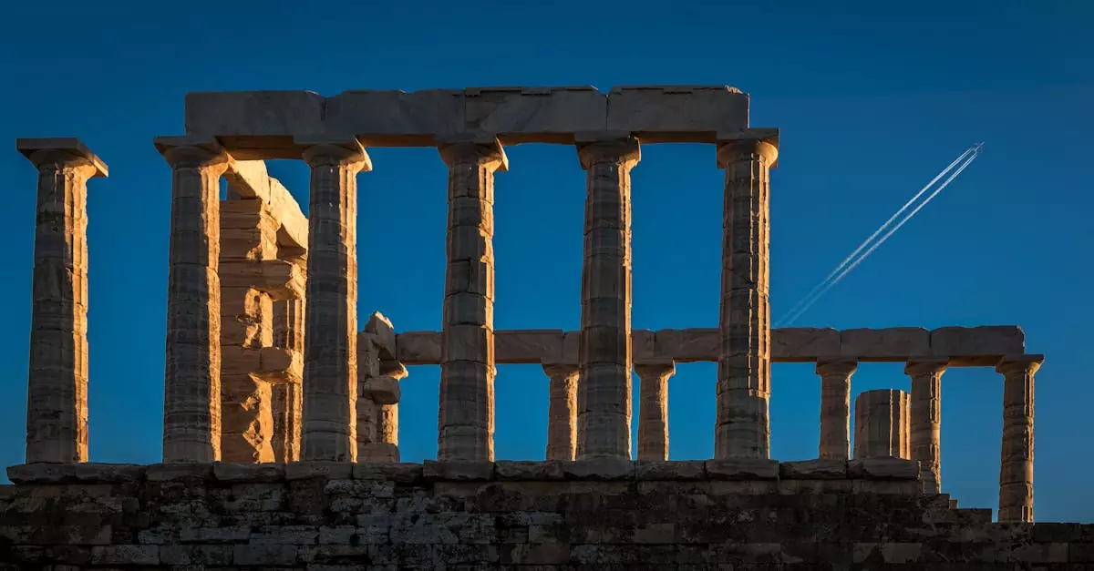 Explore the stunning Temple of Poseidon ruins at Cape Sounio against a clear blue sky.