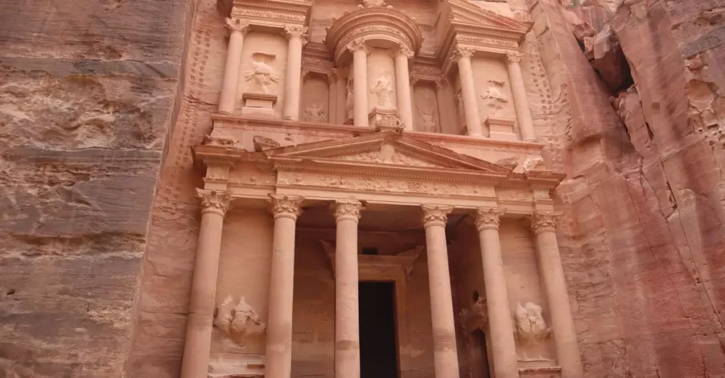 Explore the ancient rock-carved Al-Khazneh treasury in Petra, Jordan, a UNESCO World Heritage Site.