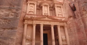 Explore the ancient rock-carved Al-Khazneh treasury in Petra, Jordan, a UNESCO World Heritage Site.