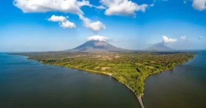 Explore the stunning aerial view of Ometepe Island and its volcanic landscape surrounded by serene waters.