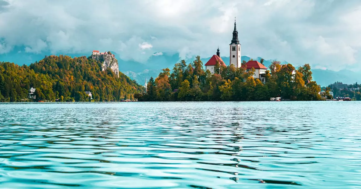 Beautiful landscape of Lake Bled with iconic church and mountain backdrop.