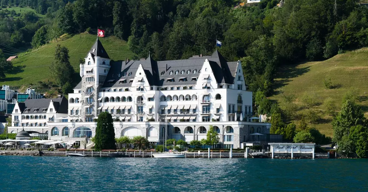 Charming grand hotel by Lake Lucerne, nestled amidst lush hills and forests in Switzerland.