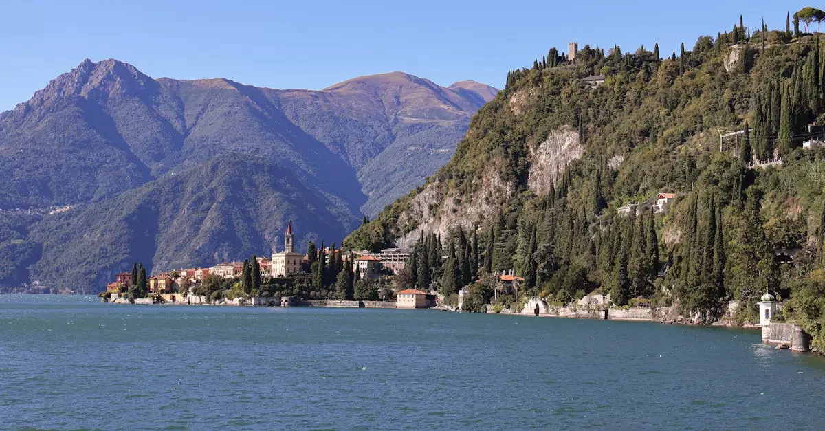 Scenic view of Lake Como with its calm waters and surrounding mountains in Varenna, Italy.