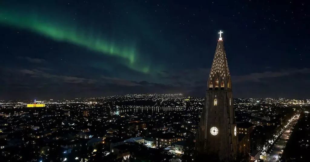 Best Northern Lights Destinations in Europe 2 Breathtaking view of the Northern Lights over Hallgrímskirkja in Reykjavik, Iceland.