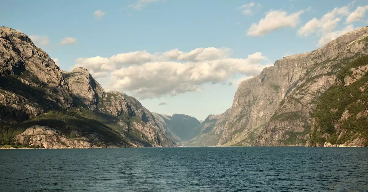 Idyllic scene of Lysefjord, Norway with calm waters and majestic mountains.