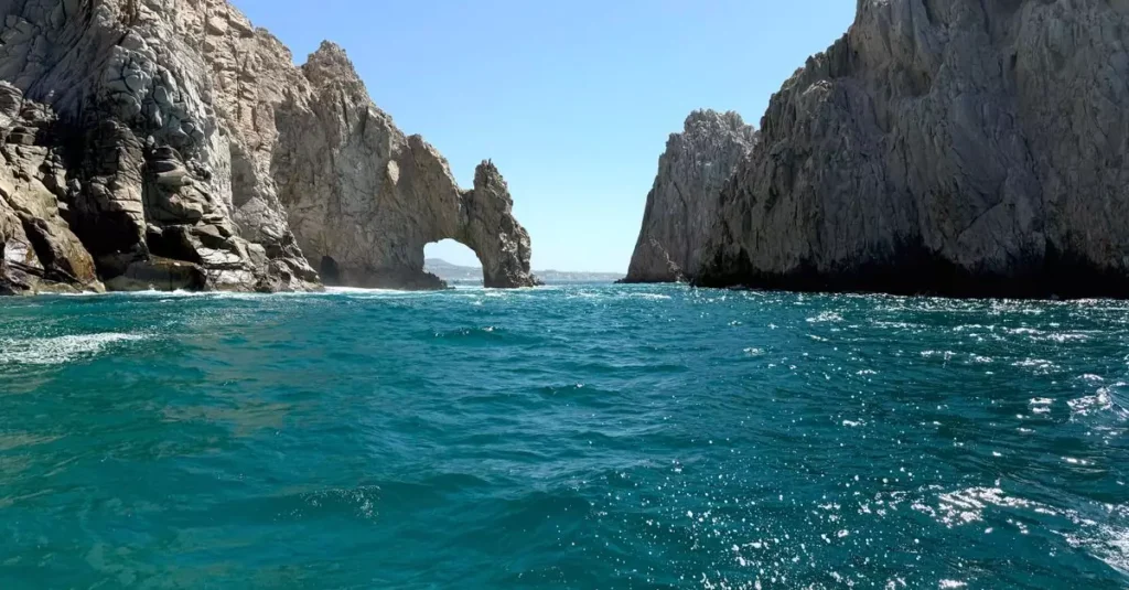 Best Ocean Wildlife Destinations: Whale Watching & More 2 Stunning view of El Arco rock formation in Cabo San Lucas with vibrant blue sea.