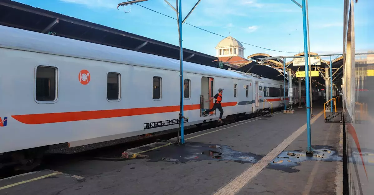 Passenger train at a station in Central Java, Indonesia during daylight, showcasing travel infrastructure.