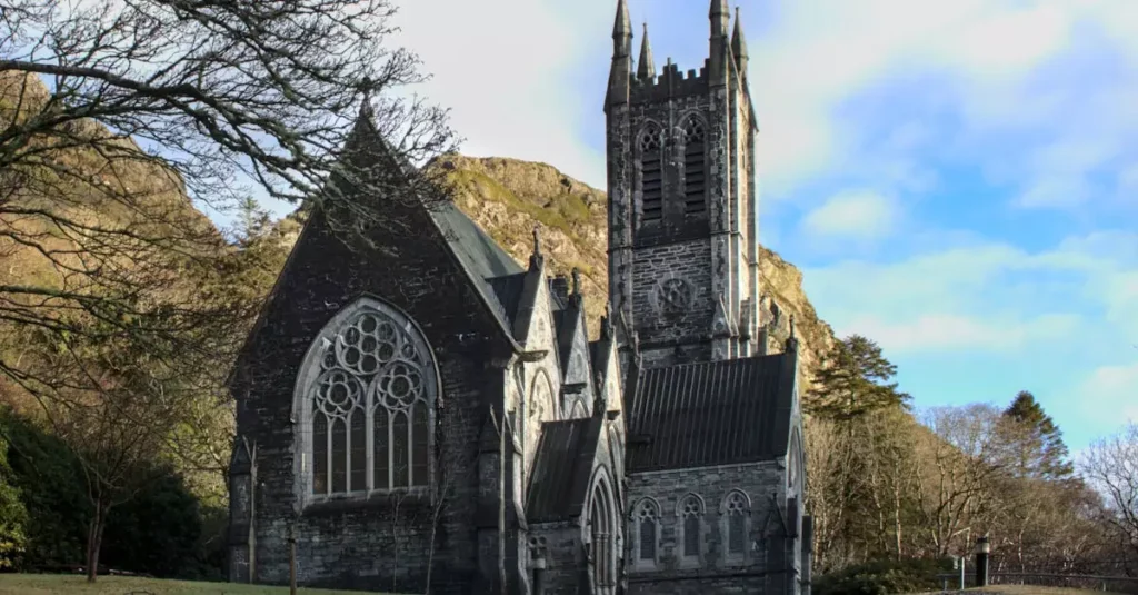 Best Places to Visit in Ireland: An Enchanting Guide 2 Stunning Gothic Revival architecture in a serene landscape, Letterfrack, Ireland.