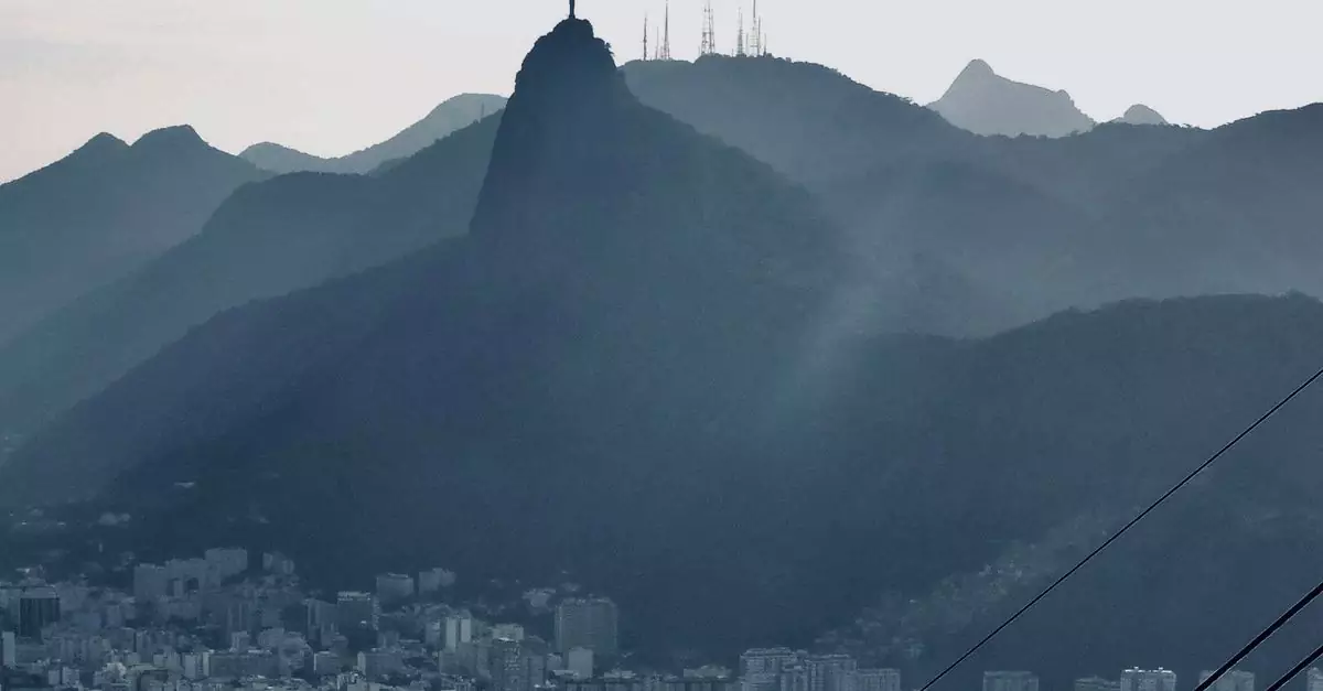 Dramatic skyline featuring Christ the Redeemer and Rio de Janeiro cityscape at dawn.
