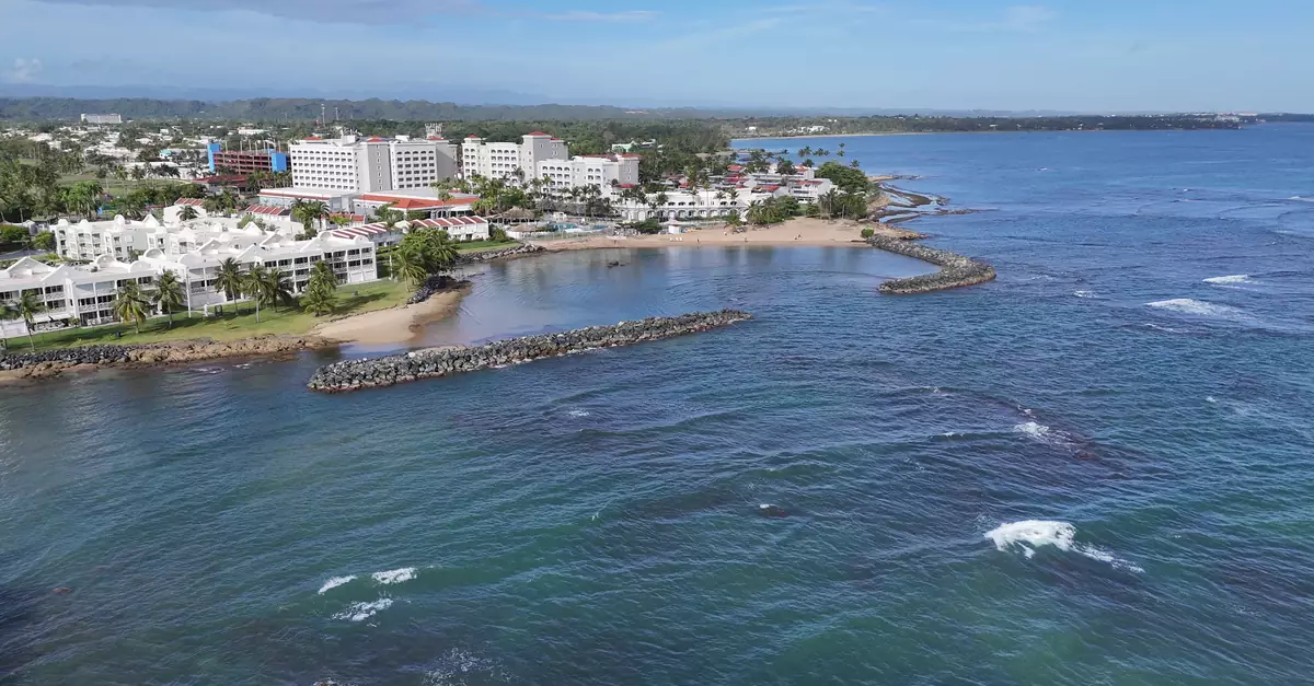 Stunning aerial view of Dorado's beachfront and resorts in Puerto Rico on a sunny day.