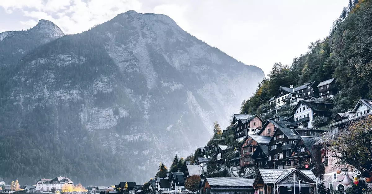 Picturesque Hallstatt village nestled between serene lake and majestic mountains in winter.