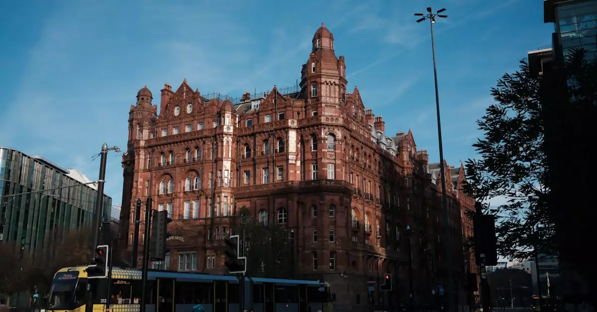 Capture of the iconic Midland Hotel in Manchester with tram in the foreground.