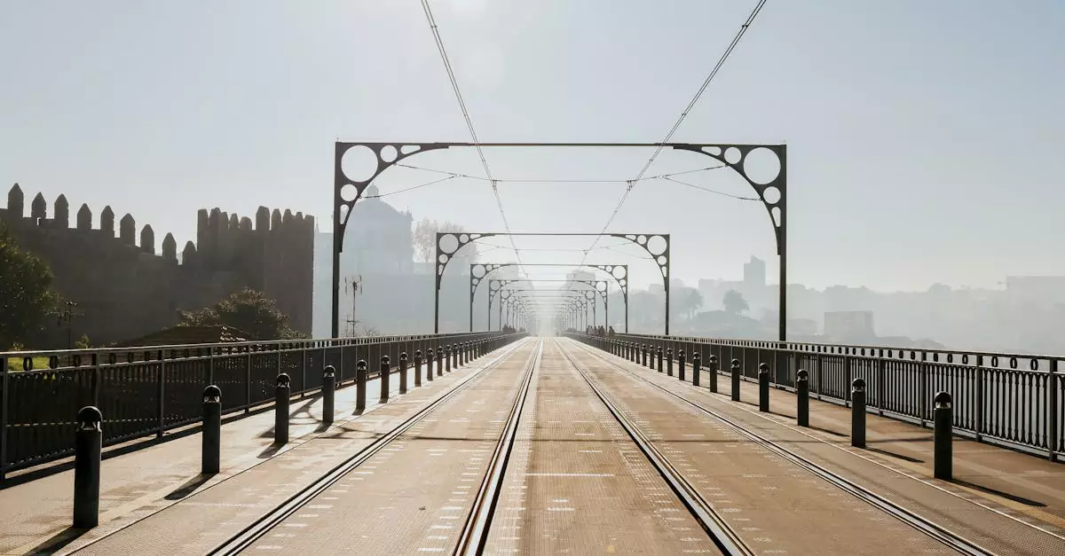 Explore the historic Dom Luís I Bridge in Porto, Portugal, shrouded in mist with a stunning urban perspective.