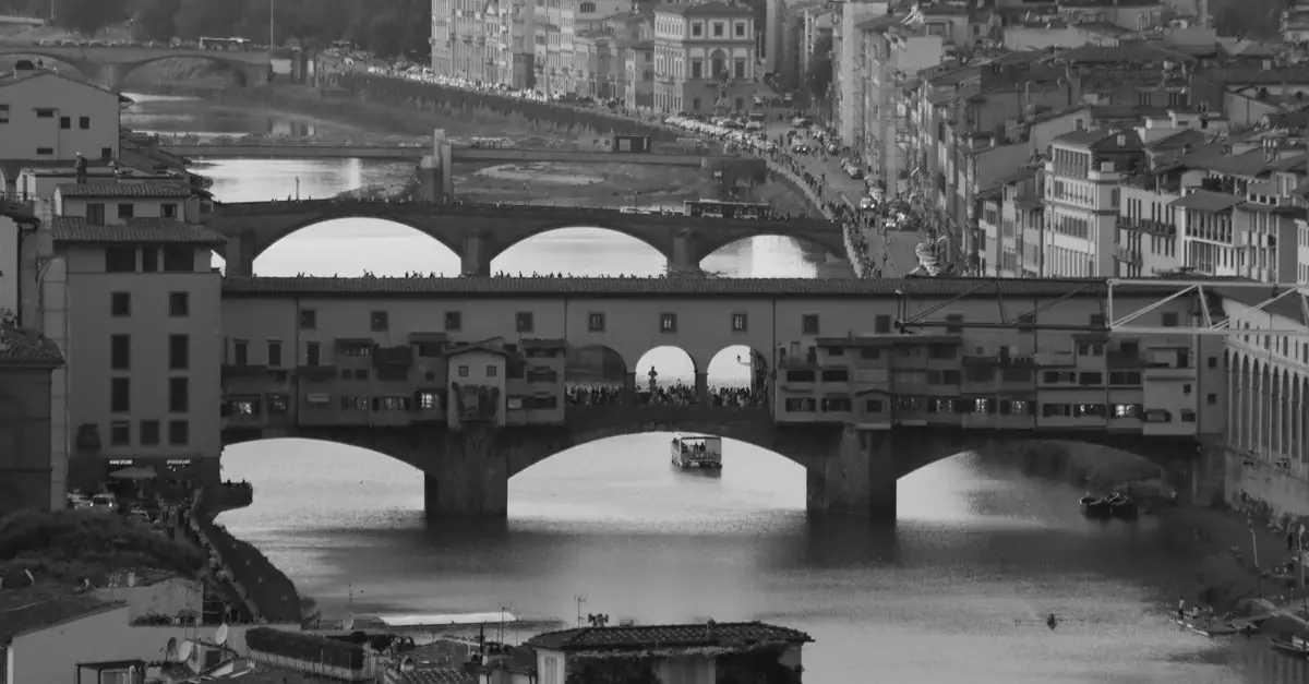 Black and white aerial view of Ponte Vecchio and Florence cityscape in Italy.