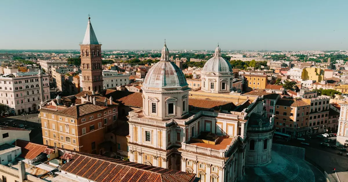 A scenic aerial view of historic architecture in Rome showcasing domes and spires under a clear sky.