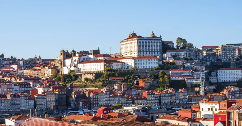 Beautiful aerial view of Porto, Portugal showcasing historic buildings and red rooftops.