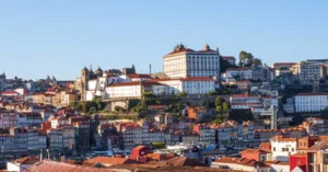 Beautiful aerial view of Porto, Portugal showcasing historic buildings and red rooftops.