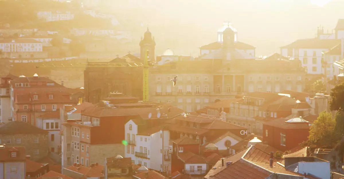 Captivating sunset view of Porto's historic rooftops, highlighting beautiful architecture and warm light.