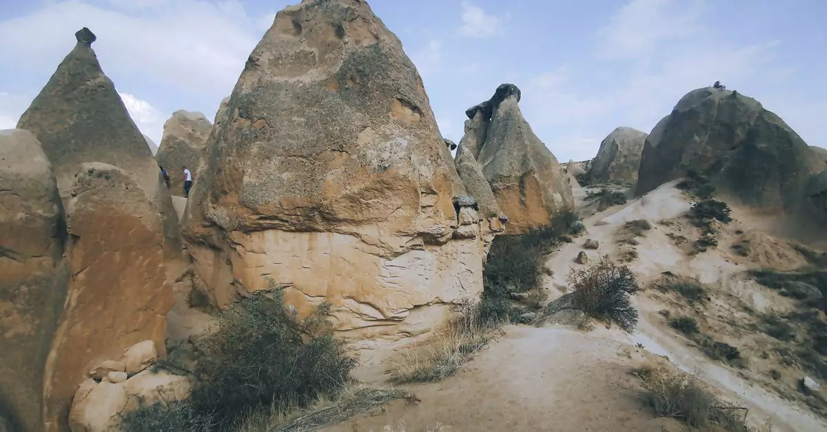Explore the unique and stunning rock formations in Cappadocia, a iconic travel destination in Turkey.
