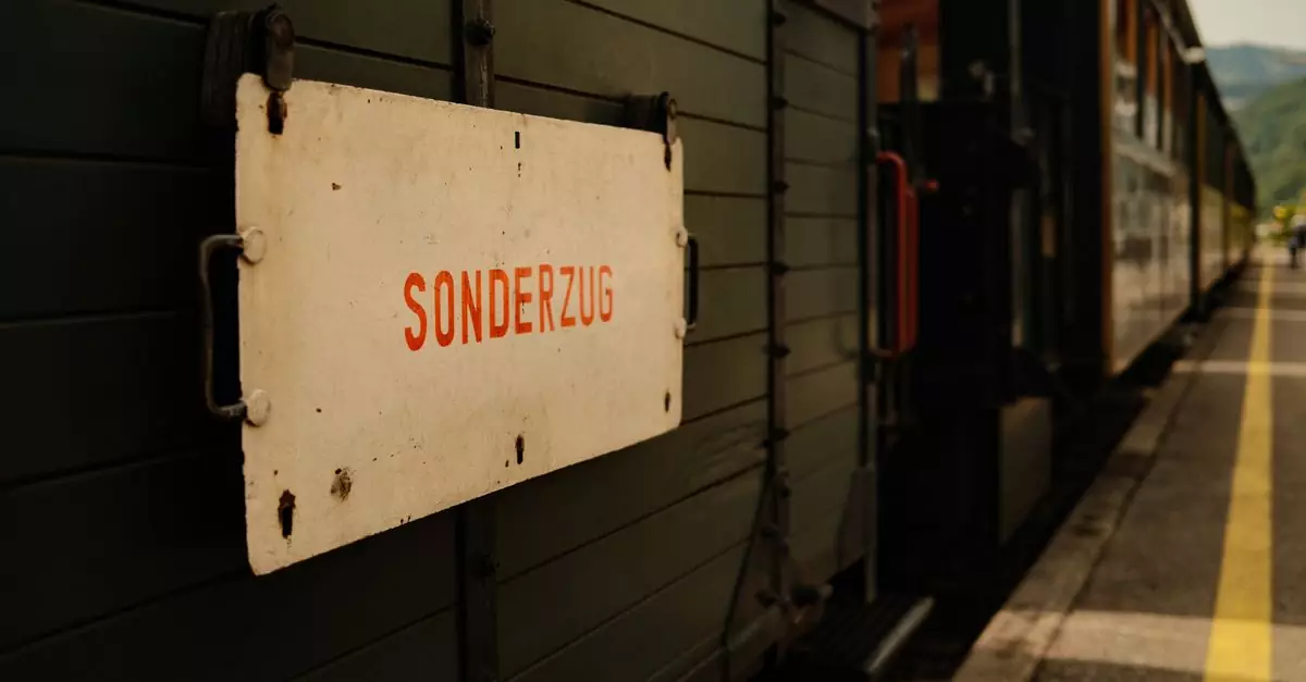 Close-up of a historic train with a 'Sonderzug' sign at a sunny outdoor station platform.
