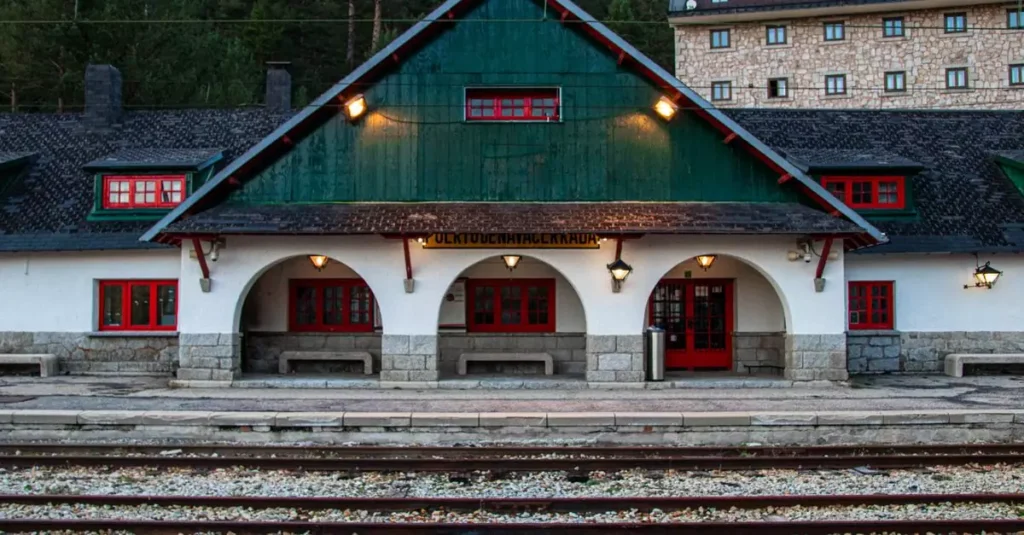 Charming historic train station architecture in Cercedilla, Spain, featuring traditional design and railway tracks.