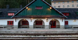 Charming historic train station architecture in Cercedilla, Spain, featuring traditional design and railway tracks.