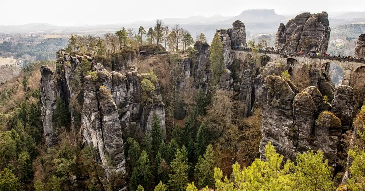 A stunning landscape of the Bastei Bridge and Elbe Sandstone Mountains in Saxony, Germany.