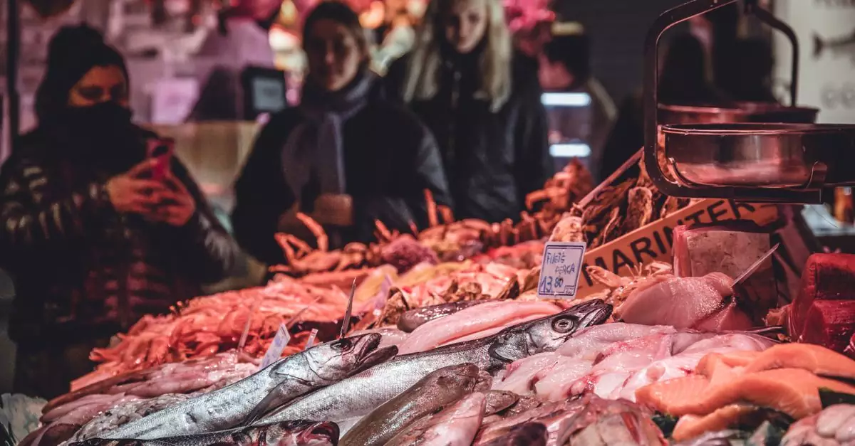 Fresh seafood displayed at a bustling market in Barcelona, Spain.