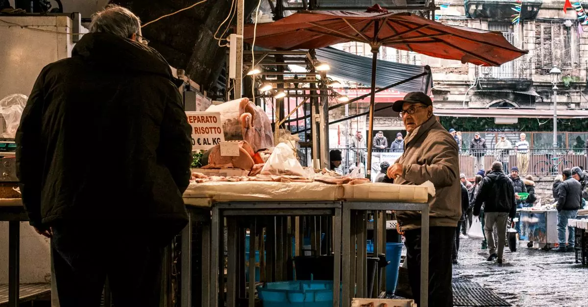 Explore the vibrant atmosphere of a bustling fish market in Catania, Sicily, showcasing local vendors and fresh produce.