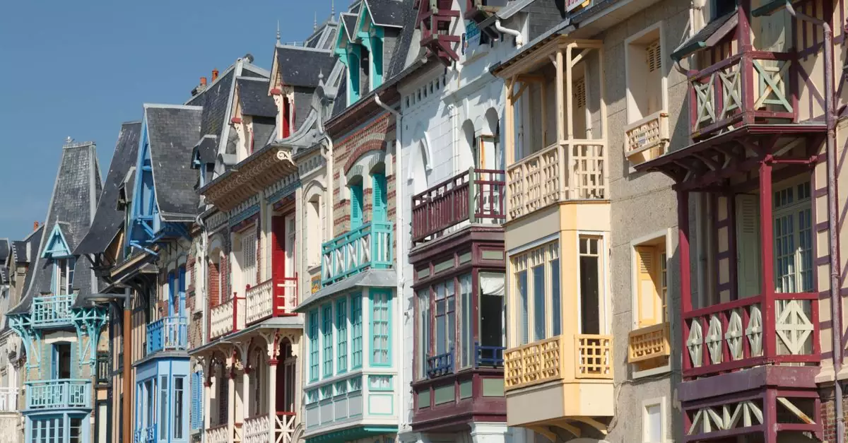 Charming Victorian facades in Mers-les-Bains, France, showcasing vibrant colors and intricate details.