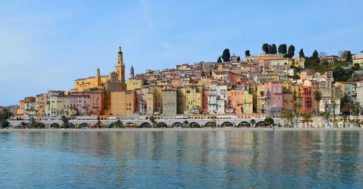 Vibrant townscape of Menton with colorful buildings along the sparkling coast of the French Riviera.