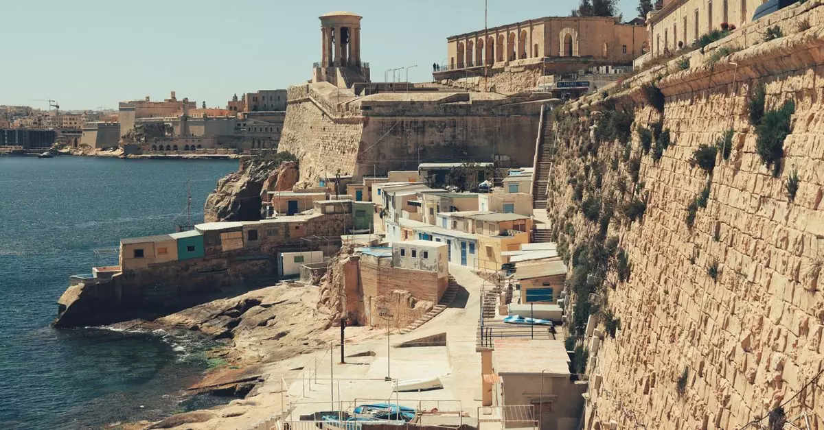 Explore the breathtaking coastal architecture of Valletta, Malta, showcasing historic buildings and the Mediterranean Sea.